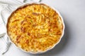 Potato gratin - graten (baked potatoes with cream and cheese) with rosemary and forks (Turkish name Kremali patates