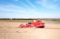 John Deere Tractor with GRIMME SE 150-60 Potato Harvester and separator.