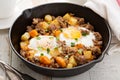 Potato hash with eggs Royalty Free Stock Photo