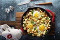 Potato hash with ham and eggs Royalty Free Stock Photo