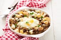 Potato hash with sausage and fried egg Royalty Free Stock Photo