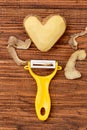 Potato heart over wooden background