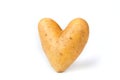 Potato in the heart shape on a white