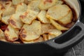 Potato hot pot in a ceramic dis with minced beef and vegetables