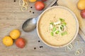 Potato and leek soup, top view table scene on light wood Royalty Free Stock Photo