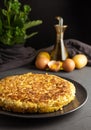 Potato omelet on dark wooden background - image Royalty Free Stock Photo