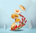 Potato pancake , salad, pieces of baguette and fried egg in levitation