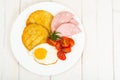 Potato pancakes, fried egg, sausage for breakfast Royalty Free Stock Photo