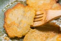 Potato pancakes on green frying pan Royalty Free Stock Photo