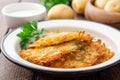 Potato pancakes or latkes or draniki in plate on dark wooden table. Top view. Copy space. Royalty Free Stock Photo