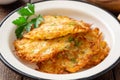 Potato pancakes or latkes or draniki in plate on dark wooden table. Top view. Copy space. Royalty Free Stock Photo