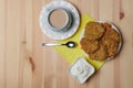 potato pancakes in a plate and a cup of coffee on a wooden background Royalty Free Stock Photo