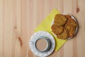 potato pancakes in a plate and a cup of coffee on a wooden background Royalty Free Stock Photo