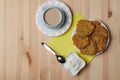 potato pancakes in a plate and a cup of coffee on a wooden background Royalty Free Stock Photo