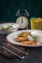 Potato pancakes on a white plate. Fresh vegetable salade and lemonade drink. Lunch time 12pm Royalty Free Stock Photo