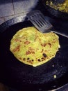 Potato paratha. Indian potato stuffed flatbread on the nonstick pan.