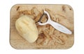 Potato peeled and prepared on a chopping board