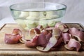 Potato peels and potatoes in water from side Royalty Free Stock Photo