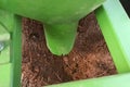 Potato planter cone directed into the soil Royalty Free Stock Photo
