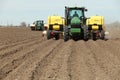 Farm equipment planting potatoes in an Idaho farm field. Royalty Free Stock Photo