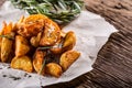 Potato. Roasted potatoes. American potatoes with salt rosemary and cumin. Roasted potato wedges delicious crispy Royalty Free Stock Photo