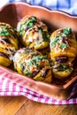 Potato.Roasts potatoes. Home cooking roasts potatoes. Baking pan full of baked potatoes stuffed with bacon sausage onions Royalty Free Stock Photo