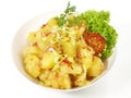 Potato Salad with Bacon and Spring Onions in a Bowl on white Background - Isolated Royalty Free Stock Photo