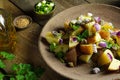 Potato salad with Dijon dressing close-up and ingredients.