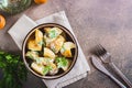 Potato salad in a peel with parsley and mayonnaise in a bowl on the table top view Royalty Free Stock Photo