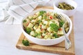 Potato salad with pickled cucumbers, parsley and mustard sauce