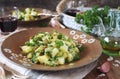 Potato salad with pickled cucumbers, parsley and olive oil