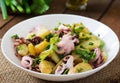 Potato salad with pickled octopus and onions Royalty Free Stock Photo