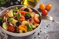 Potato salad with tomatoes, olives, capers, red onion, italian style cuisine. Insalata Pantesca. Royalty Free Stock Photo