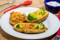 Potato Skins appetizer with broccoli, cheddar cheese and fried onions Royalty Free Stock Photo