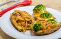 Potato Skins appetizer with broccoli, cheddar cheese and fried onions Royalty Free Stock Photo