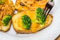 Potato Skins appetizer with broccoli, cheddar cheese and fried onions Royalty Free Stock Photo