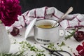 Potato soup in white bowl with handle and lid on white table with black background Royalty Free Stock Photo