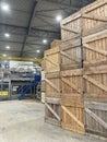 Potato storage facility. Forklift used to stack the crates. Refrigerated cold warehouse for potatoes and onions with wooden boxes. Royalty Free Stock Photo