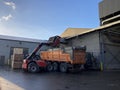 Potato storage facility. Forklift used to stack the crates. Potato transport truck with wooden boxes. Royalty Free Stock Photo