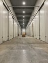 Potato storage facility. Refrigerated cold warehouse for potatoes and onions with wooden boxes. Royalty Free Stock Photo