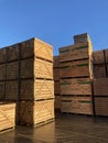 Potato storage facility. Wooden boxes used for potatoes and onions are stacked outside the warehouse. Royalty Free Stock Photo