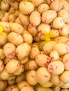 Potato tubes close up on the farm market stall. Food background Royalty Free Stock Photo