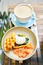 Potato waffles, Poached egg, avocado cream with salmon and egg . Healthy breakfast, protein. Restaurant dish. Royalty Free Stock Photo