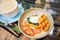 Potato waffles, Poached egg, avocado cream with salmon and egg . Healthy breakfast, protein. Restaurant dish. Royalty Free Stock Photo