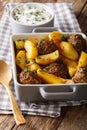 Potato wedges and meatballs, herbs in a dish close-up. vertical Royalty Free Stock Photo