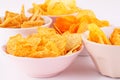 Potato and wheat chips in bowls