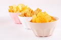 Potato and wheat chips in bowls