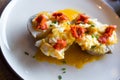 Potatoes al caliu with fried eggs and sobrassada