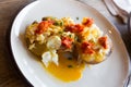 Potatoes al caliu with fried eggs and sobrassada