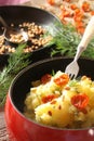 Potatoes boiled with fried pine nuts and sun dried tomatoes